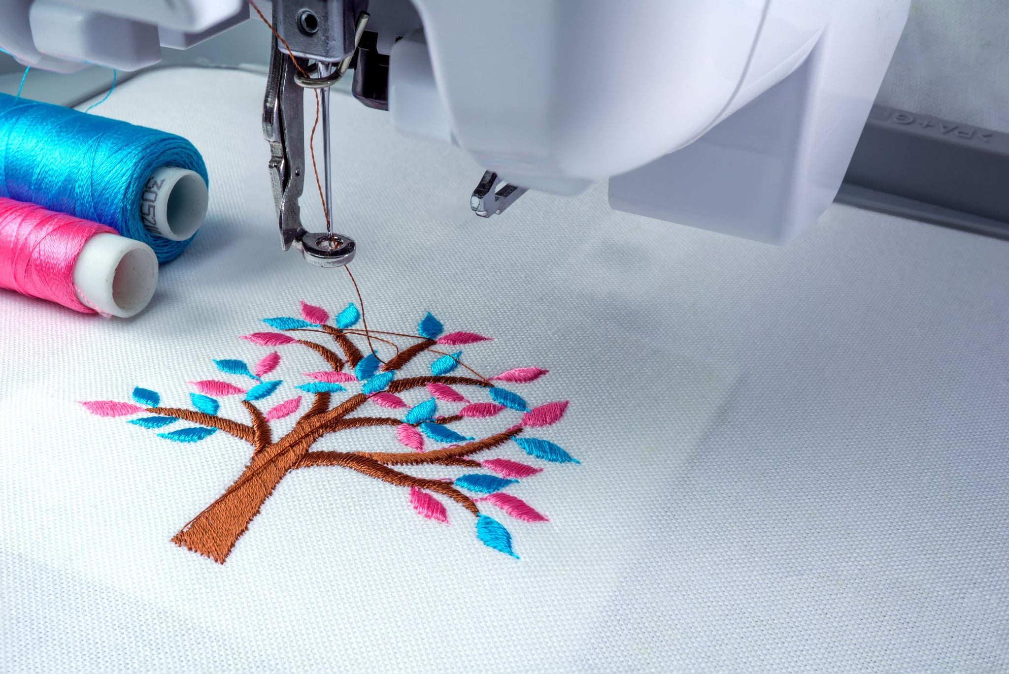 embroidery machine show embroider tree design - LMI Textiles
